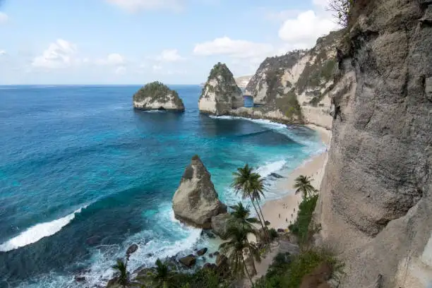 The curved coastline of Atuh Beach